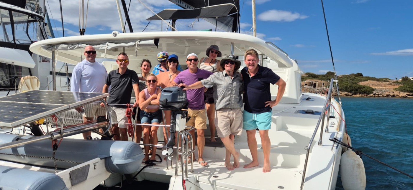 Uwe at the helm — Nomad Sailing Retreat